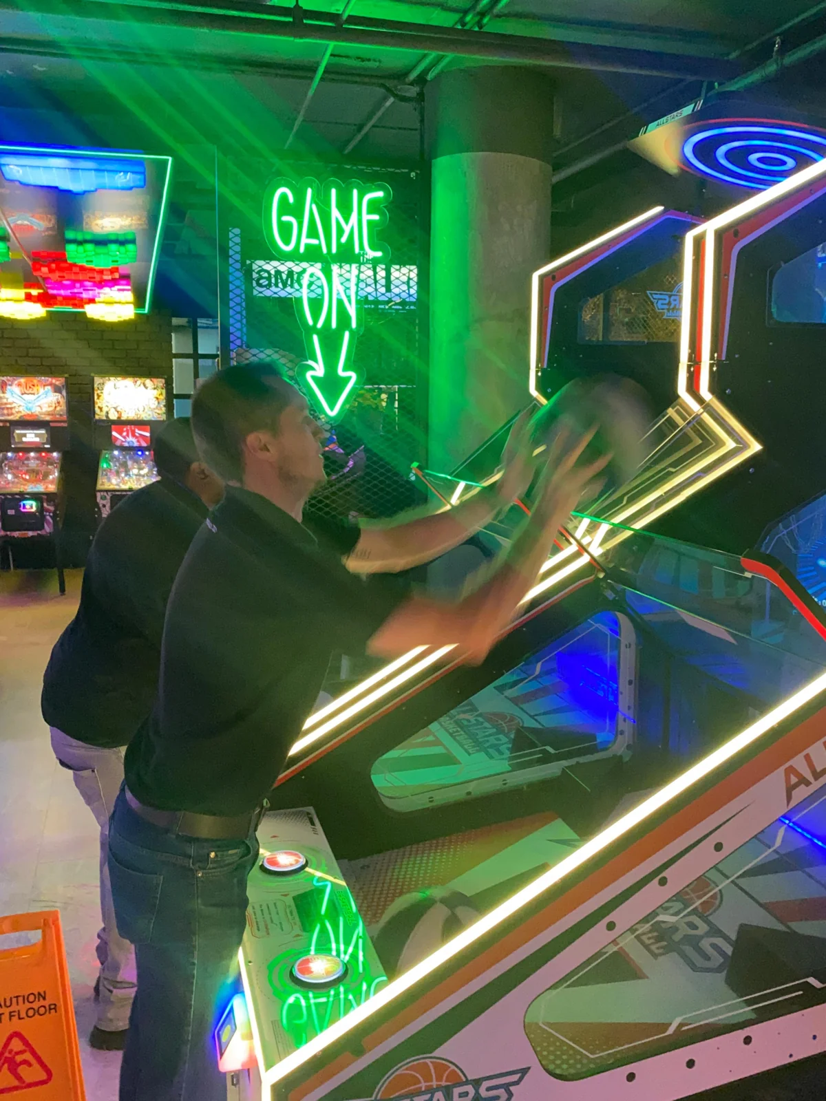 SelfieBox team enjoying an arcade basketball game
