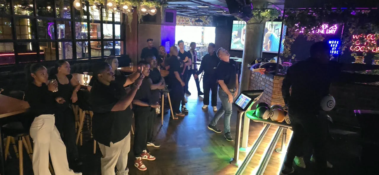 The Gauteng team gathered beside the bowling lanes