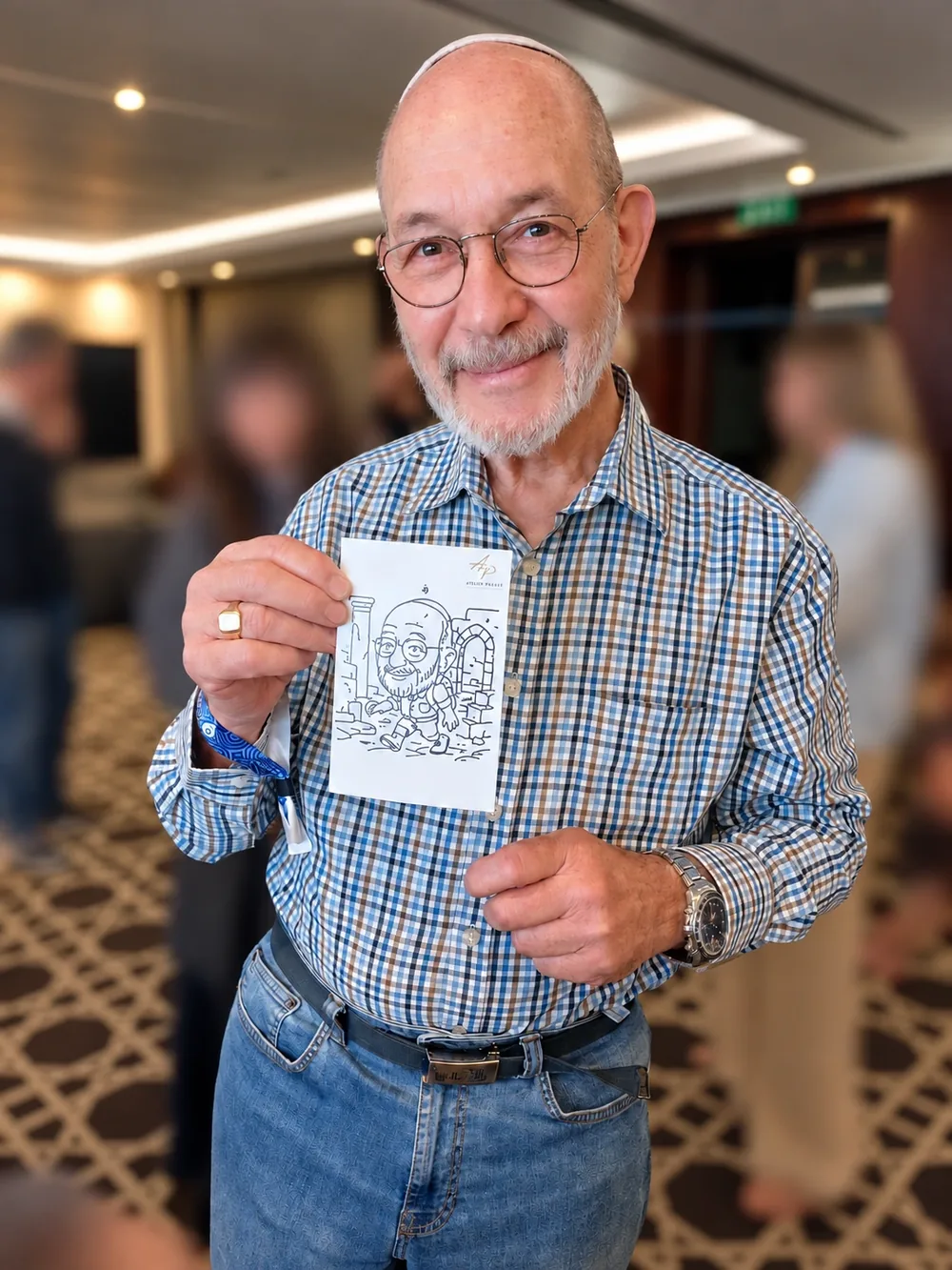 A smiling guest holding his SketchBot portrait