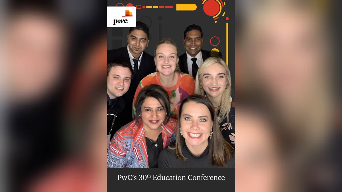 Conference guests enjoying a branded photo booth experience