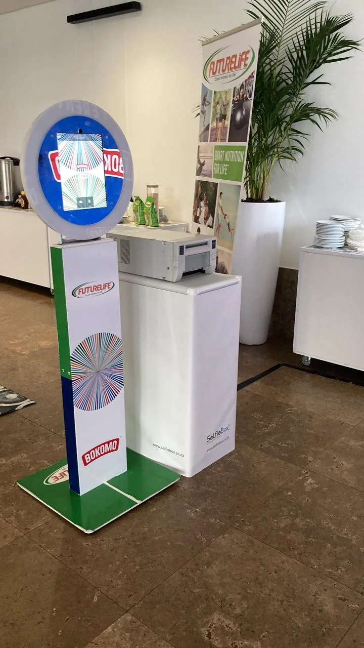 A branded SelfieBox HaloBox setup for a corporate event activation