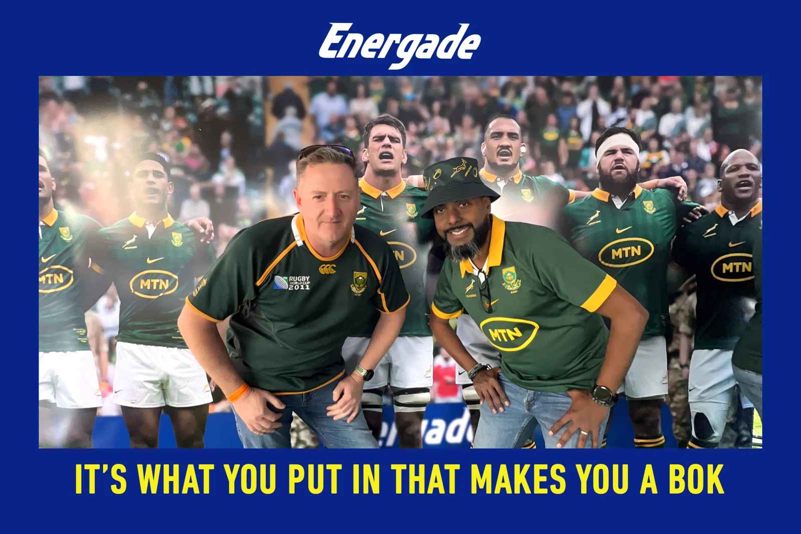 Two supporters in Springbok jerseys posing for an Energade branded SelfieBox photograph