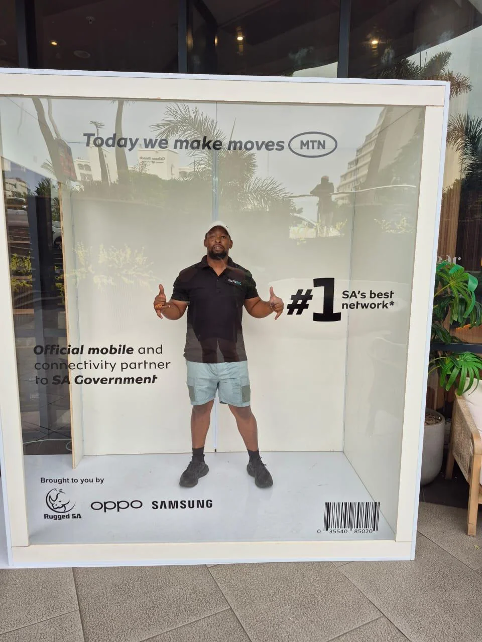 A man posing inside the MTN branded magazine booth