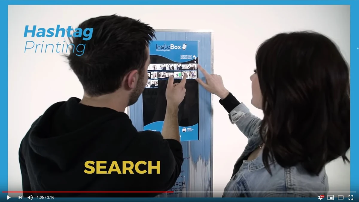 Guests using hashtag printing as a photo booth add-on