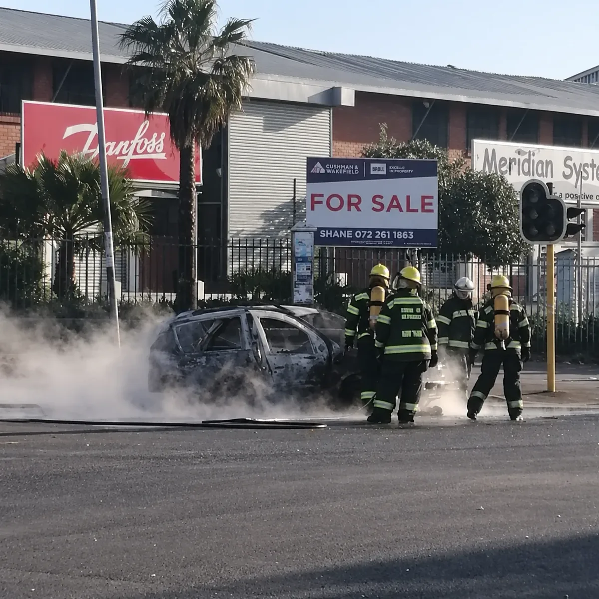 The scene around the burnt-out car in Cape Town.