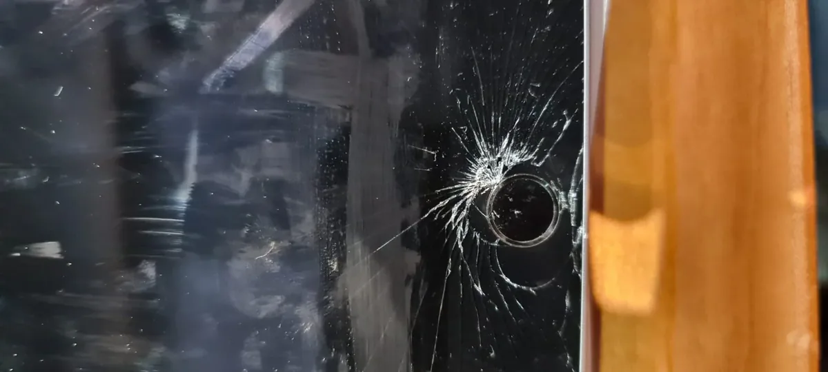 Cracked glass on a photo booth screen.