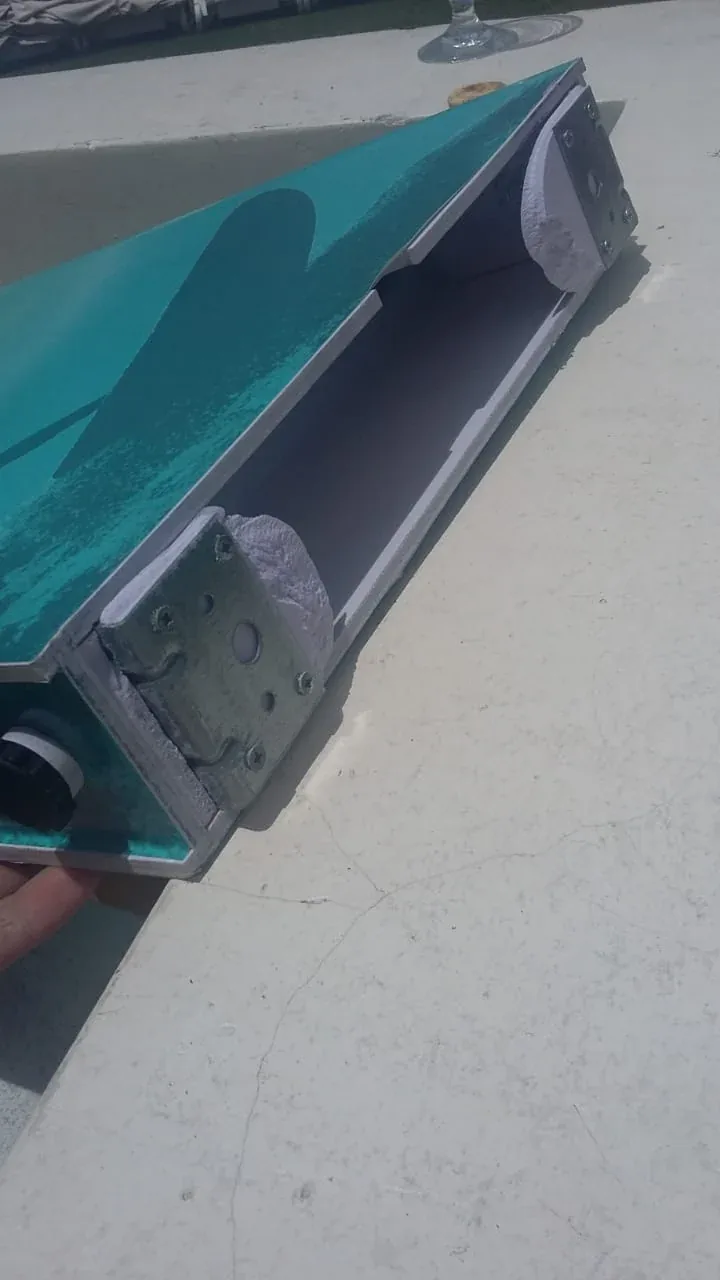 Damage to the edge of a photo booth casing.
