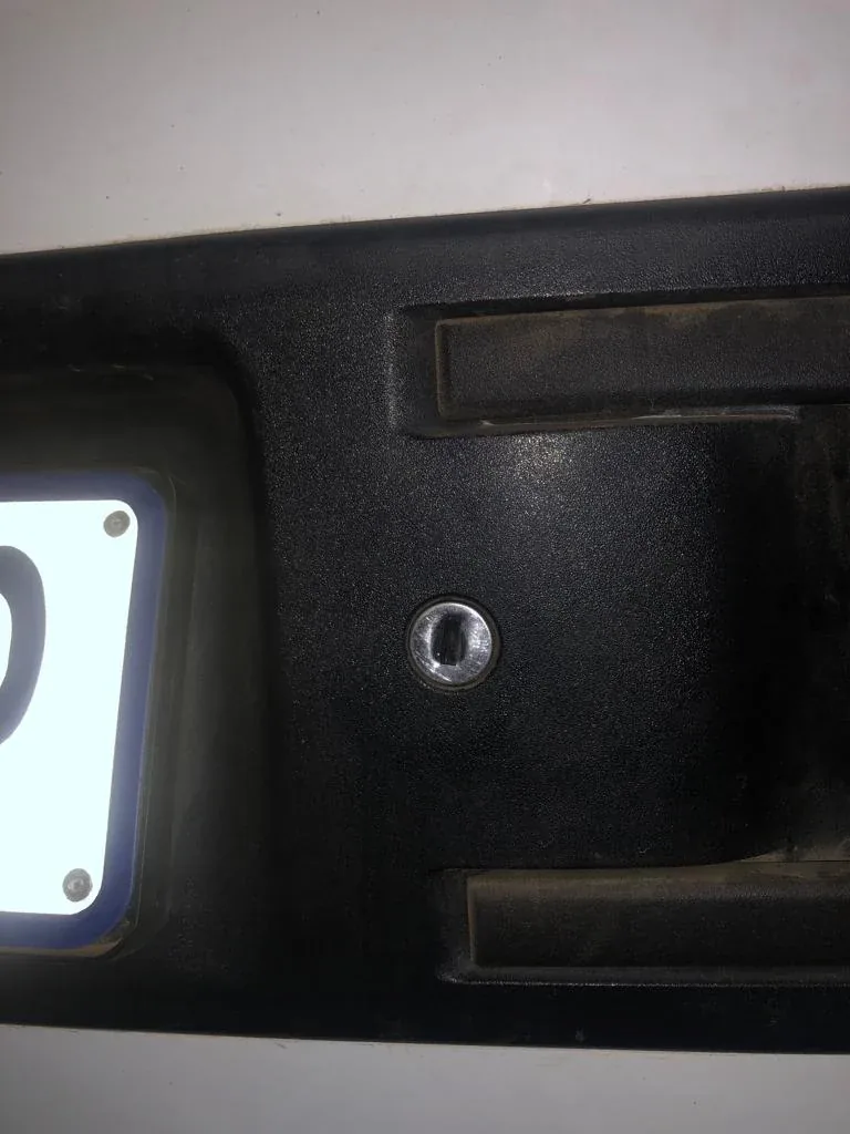 Damage around a vehicle’s door lock.