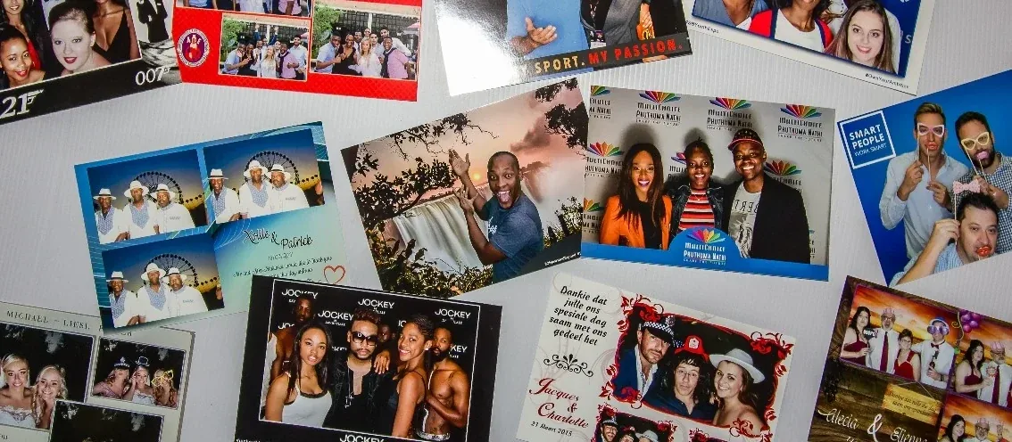 Collection of branded photo booth prints in different sizes and layouts