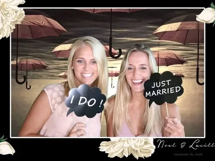 Noel and Lucille wedding guests using the SelfieBox photo booth in Stellenbosch